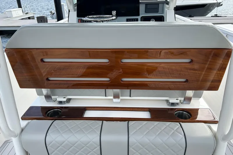  Yacht Photos Pics 2023 Pursuit S 288 Sport boat interior with wood accents and cup holders.
