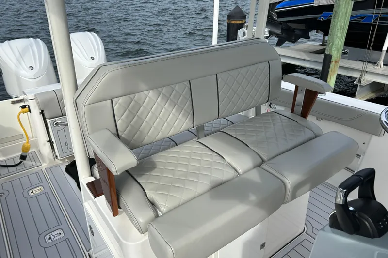  Yacht Photos Pics 2023 Pursuit S 288 Sport boat with luxurious quilted seating and dual outboard motors.