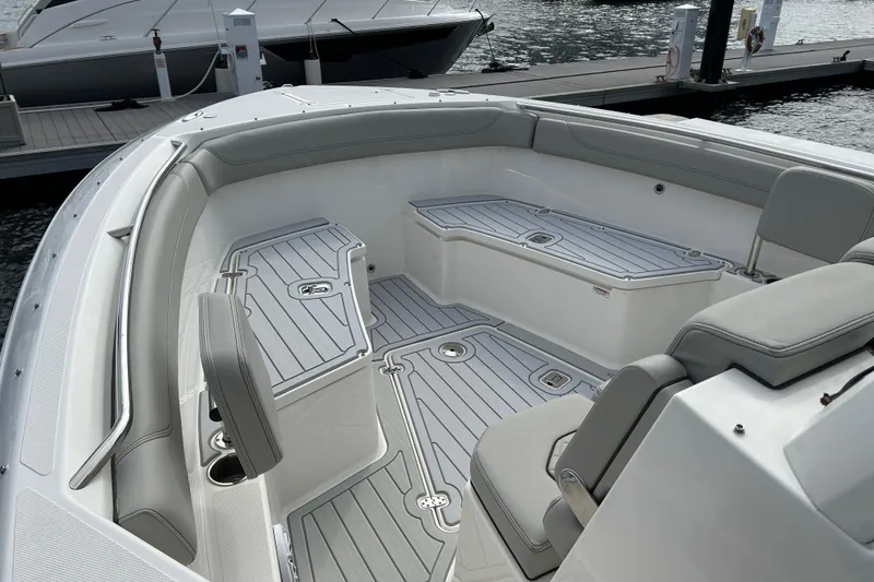  Yacht Photos Pics 2023 Pursuit S 288 Sport boat interior with sleek seating and modern design.