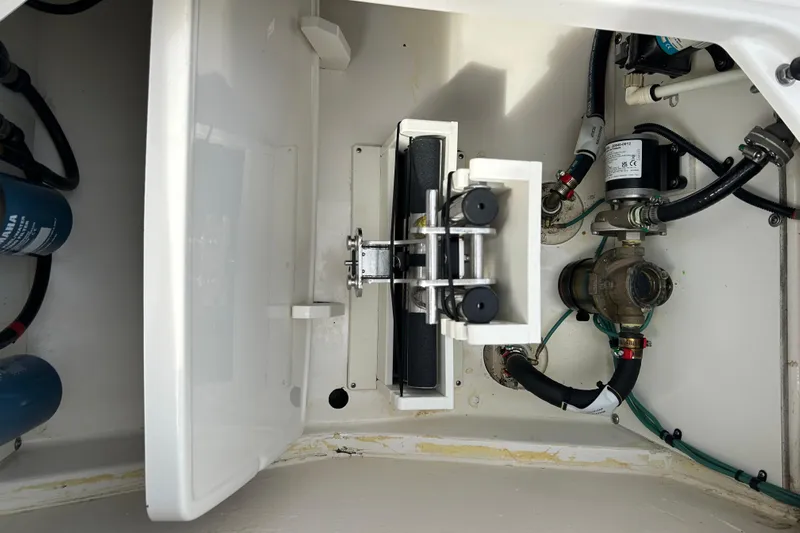  Yacht Photos Pics 2023 Pursuit S 288 Sport boat engine compartment with mechanical components and wiring.