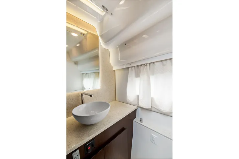 Hoff Yacht Photos Pics Luxurious bathroom interior of 2016 Regal 42 Grande Coupe yacht with modern sink design.