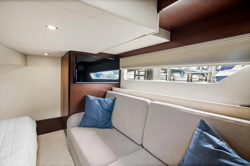 Hoff Yacht Photos Pics Luxurious interior of 2016 Regal 42 Grande Coupe yacht with sofa and TV.