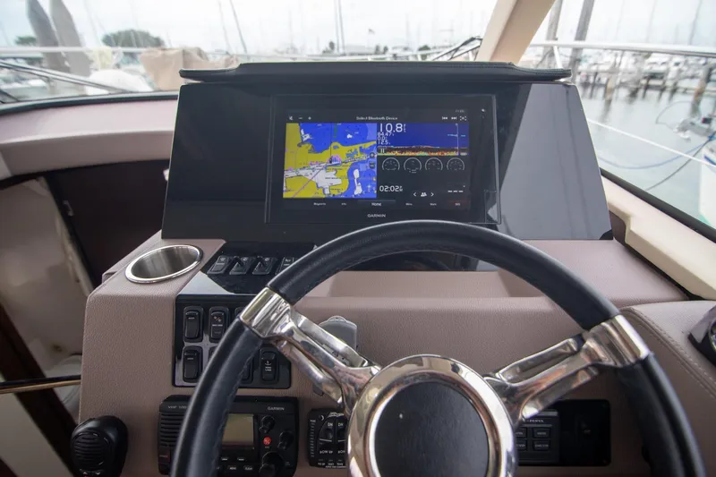 Hoff Yacht Photos Pics Helm of 2016 Regal 42 Grande Coupe with navigation display and controls.