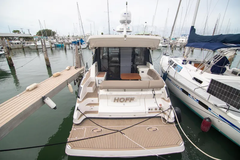 Hoff Yacht Photos Pics 2016 Regal 42 Grande Coupe yacht docked at marina, rear view.