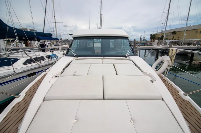 Hoff Yacht Photos Pics 2016 Regal 42 Grande Coupe yacht docked at marina, featuring spacious deck and sleek design.