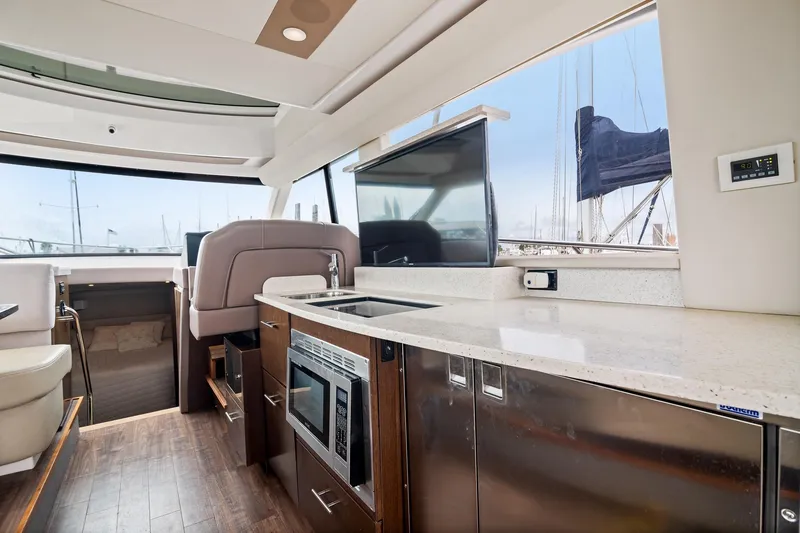 Hoff Yacht Photos Pics Luxurious interior of 2016 Regal 42 Grande Coupe yacht with modern kitchen amenities.