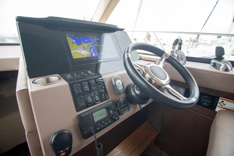 Hoff Yacht Photos Pics Helm of 2016 Regal 42 Grande Coupe with navigation display and controls.
