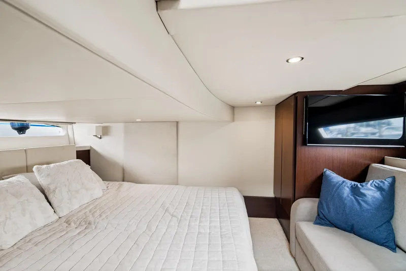 Hoff Yacht Photos Pics Luxurious interior of 2016 Regal 42 Grande Coupe yacht with cozy bed and TV.