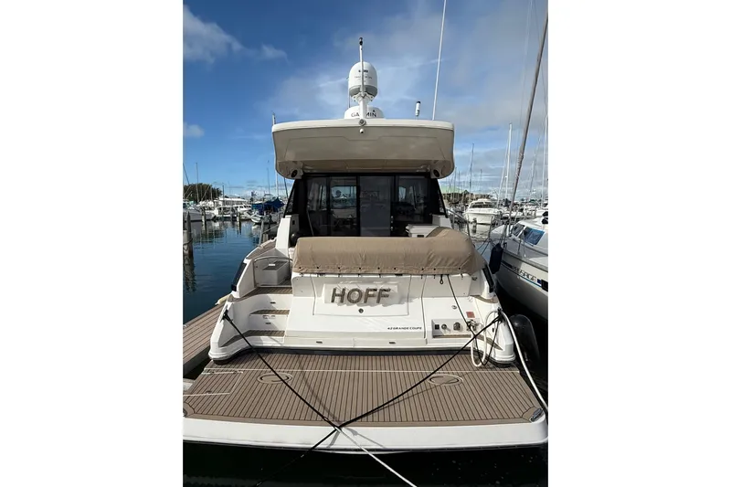 Hoff Yacht Photos Pics 2017 Regal 42 Grande Coupe yacht docked at marina, rear view.