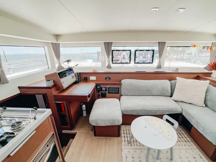 Cloud II Yacht Photos Pics Interior of 2023 Lagoon 40 catamaran with modern seating and navigation area.