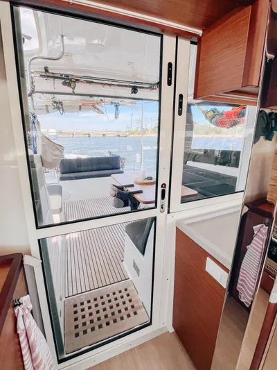 Cloud II Yacht Photos Pics Interior view of 2023 Lagoon 40 catamaran, featuring sleek design and spacious deck area.