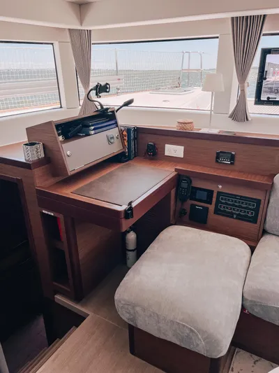 Cloud II Yacht Photos Pics 2023 Lagoon 40 yacht interior with navigation station and comfortable seating.