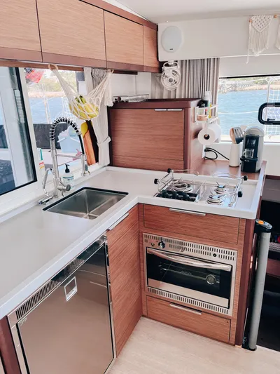 Cloud II Yacht Photos Pics Modern kitchen in 2023 Lagoon 40 yacht with stove, oven, and sink.