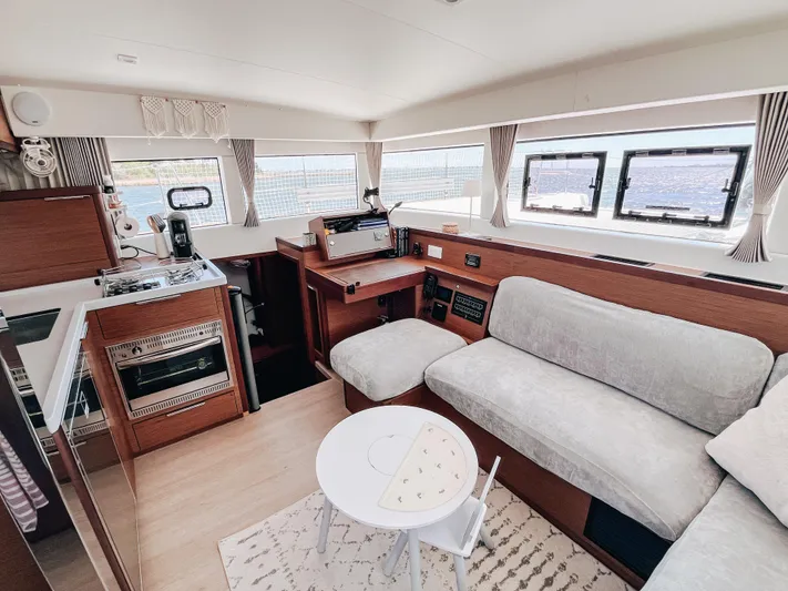Cloud II Yacht Photos Pics Interior of 2023 Lagoon 40 yacht with modern kitchen and cozy seating area.