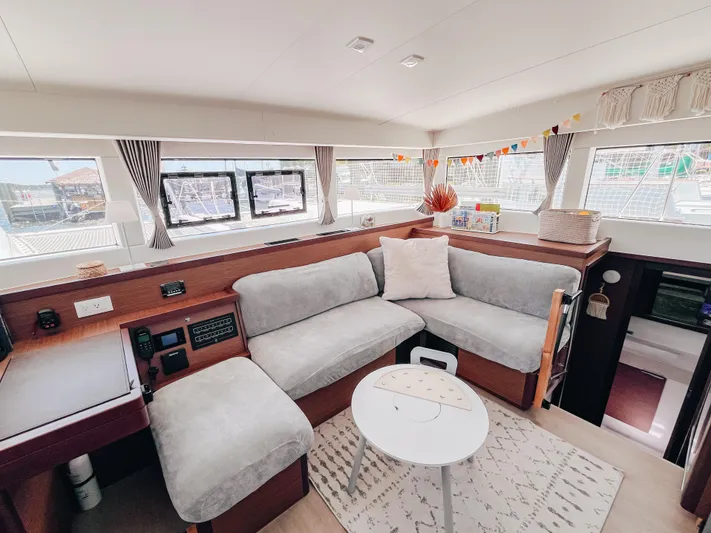 Cloud II Yacht Photos Pics Luxurious interior of 2023 Lagoon 40 catamaran with cozy seating and modern decor.