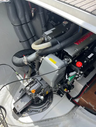 Cloud II Yacht Photos Pics Engine compartment of a 2023 Lagoon 40 catamaran, showcasing mechanical components and hoses.