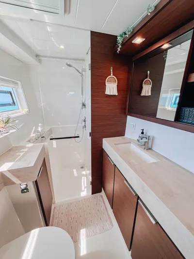 Cloud II Yacht Photos Pics Luxurious bathroom in 2023 Lagoon 40 yacht with modern fixtures and elegant design.