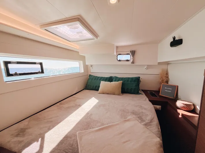 Cloud II Yacht Photos Pics Luxurious cabin interior of 2023 Lagoon 40 catamaran with ocean view windows.