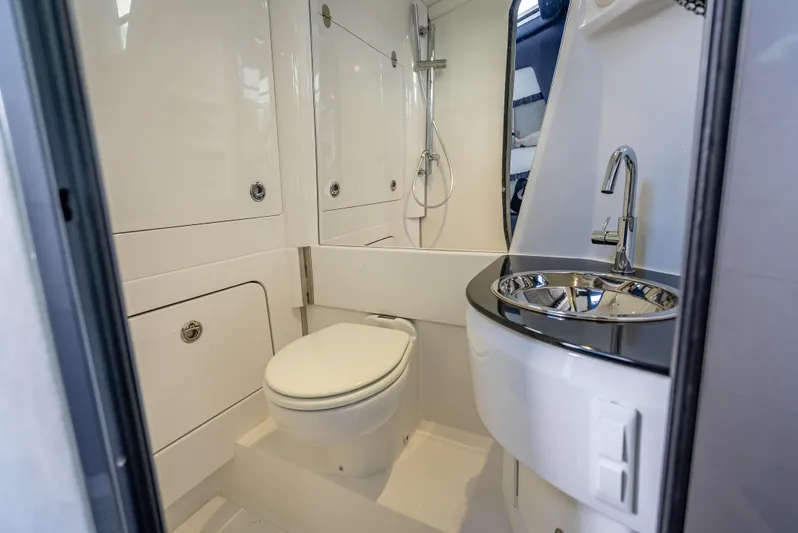  Yacht Photos Pics 2024 Nor-Tech 450 Sport Center Console bathroom with modern fixtures and sleek design.