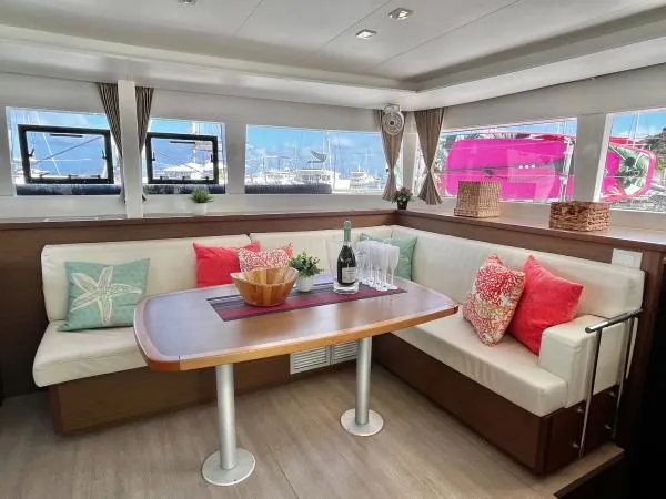 Smooth Sailor Yacht Photos Pics Luxurious interior of 2019 Lagoon 450 catamaran with elegant dining area and scenic windows.