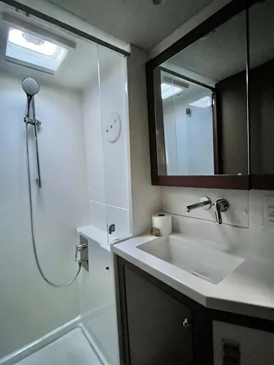 Smooth Sailor Yacht Photos Pics Modern bathroom in 2019 Lagoon 450 yacht with shower and sleek vanity.