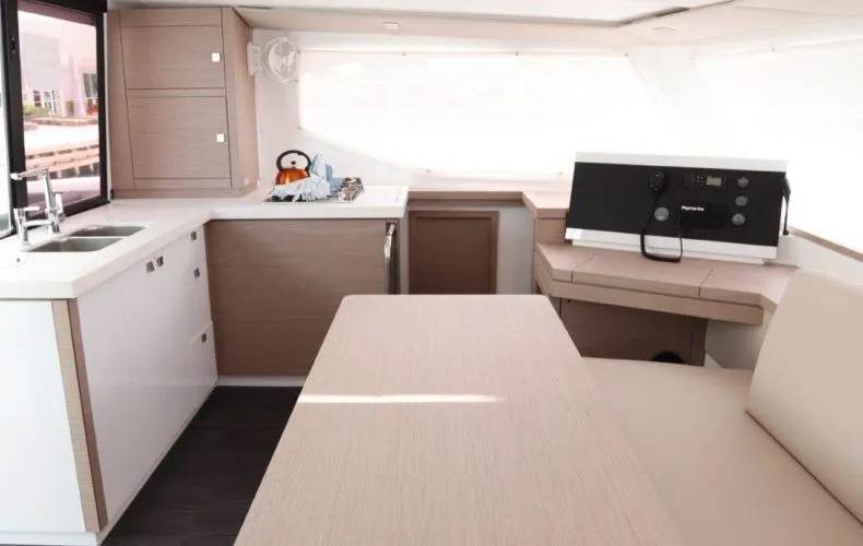 Wish You Were Here Yacht Photos Pics Interior of Fountaine Pajot Lucia 40 yacht, modern kitchen and dining area.