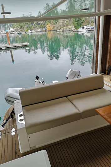 City Lights Yacht Photos Pics 2021 Maritimo X50 yacht interior with lake view, featuring a comfortable seating area.