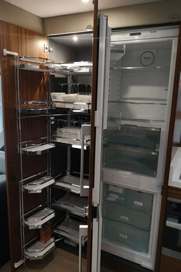 City Lights Yacht Photos Pics Modern kitchen storage and refrigerator in 2021 Maritimo X50 yacht.