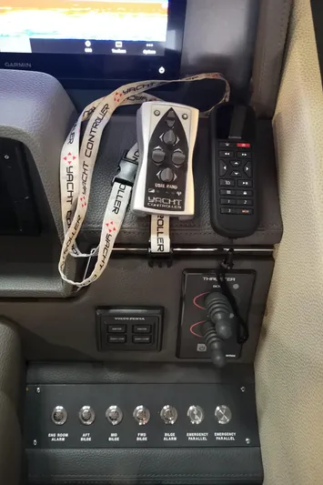 City Lights Yacht Photos Pics Control panel of a 2021 Maritimo X50 yacht with various switches and remote controls.
