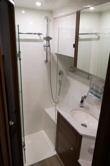 City Lights Yacht Photos Pics 2021 Maritimo X50 yacht bathroom with modern shower and sleek vanity.