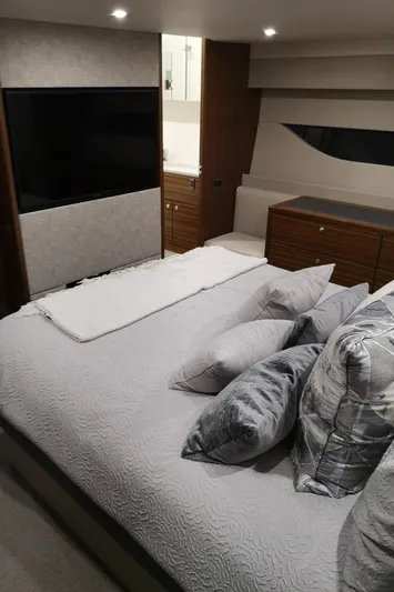 City Lights Yacht Photos Pics Luxurious bedroom interior of 2021 Maritimo X50 yacht with modern decor and cozy bedding.