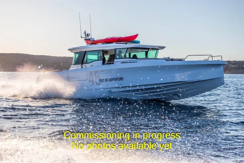  Yacht Photos Pics 2024 Axopar 45 XC Cross Cabin BRABUS Trim cruising on water, commissioning in progress.