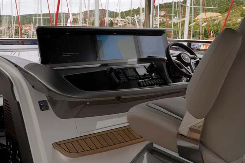  Yacht Photos Pics Helm station of 2025 Princess Y95 yacht with modern controls and comfortable seating.