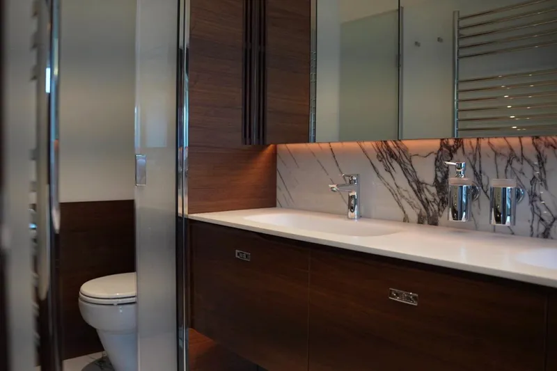 Yacht Photos Pics Luxurious bathroom in 2025 Princess Y95 yacht with marble accents and modern fixtures.