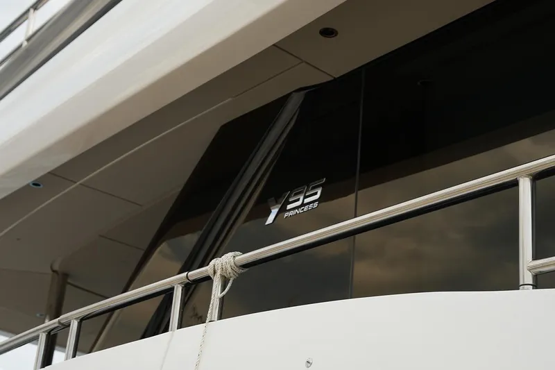  Yacht Photos Pics 2025 Princess Y95 yacht exterior with sleek design and modern railing.