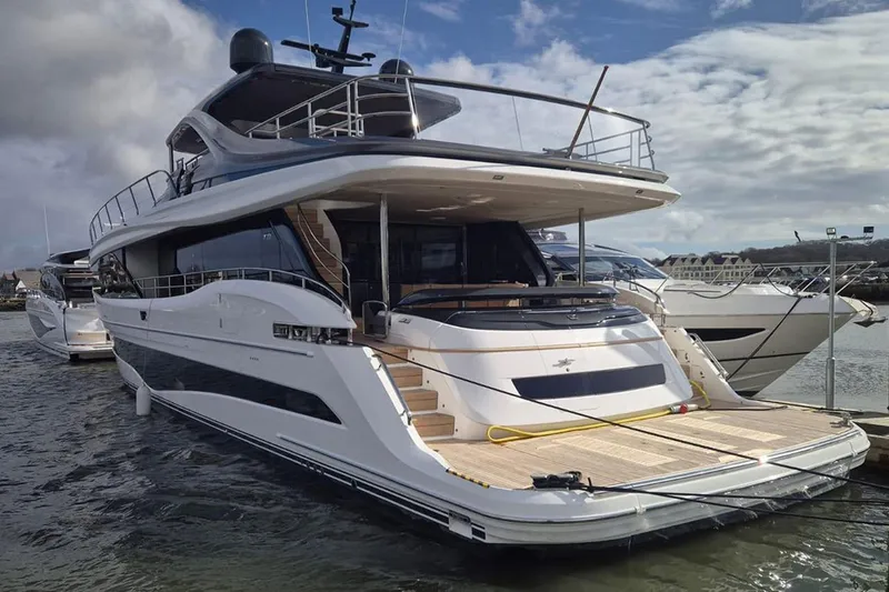  Yacht Photos Pics Luxury 2025 Princess Y95 yacht docked, showcasing sleek design and modern features.
