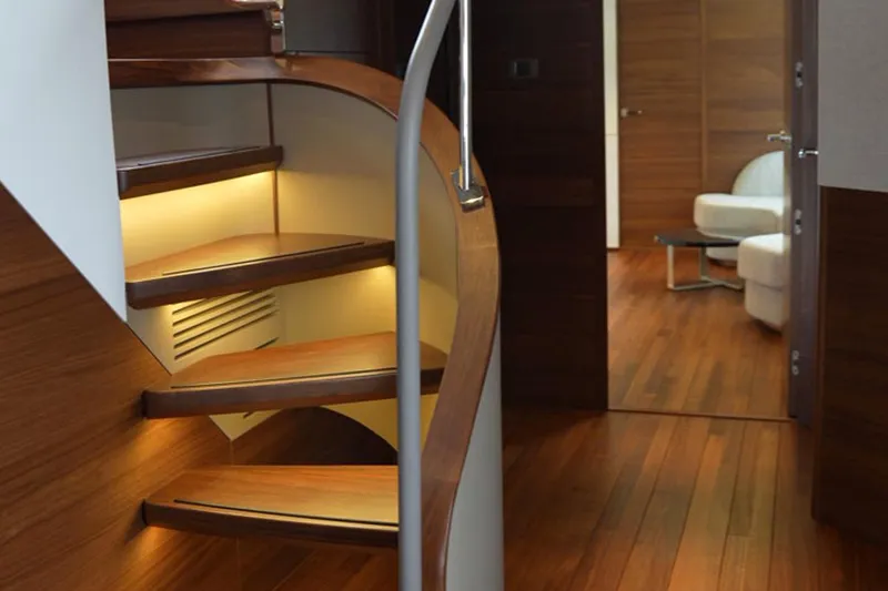  Yacht Photos Pics Luxurious wooden staircase and interior of 2025 Princess Y95 yacht.