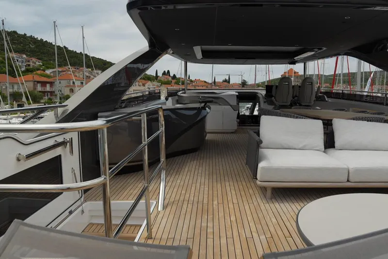  Yacht Photos Pics Luxurious 2025 Princess Y95 yacht deck with modern seating and sleek design.