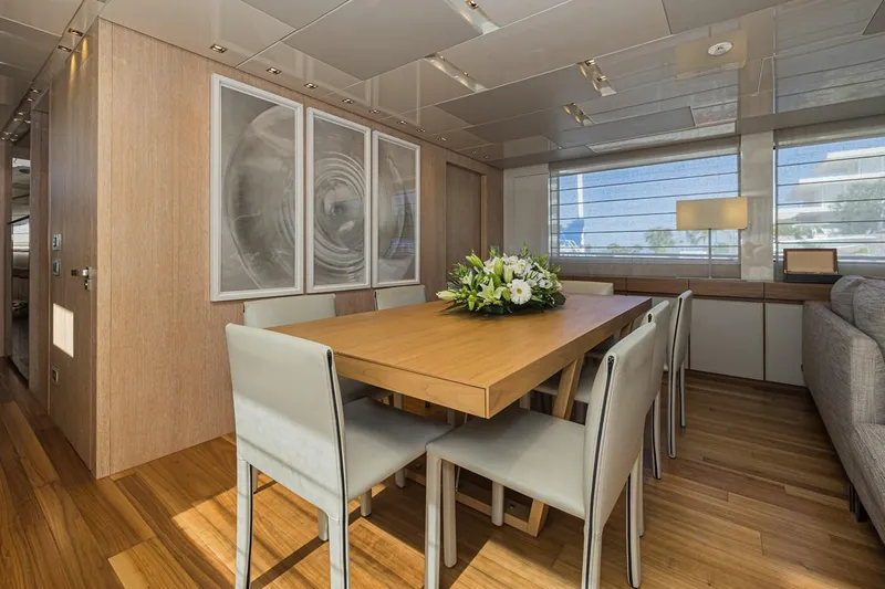 Percal Yacht Photos Pics Luxurious dining area on 2014 Sanlorenzo SL104-586 yacht with elegant decor and large windows.