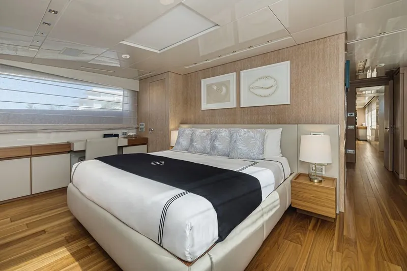 Percal Yacht Photos Pics Luxurious bedroom interior of 2014 Sanlorenzo SL104-586 yacht with modern decor and wooden flooring.