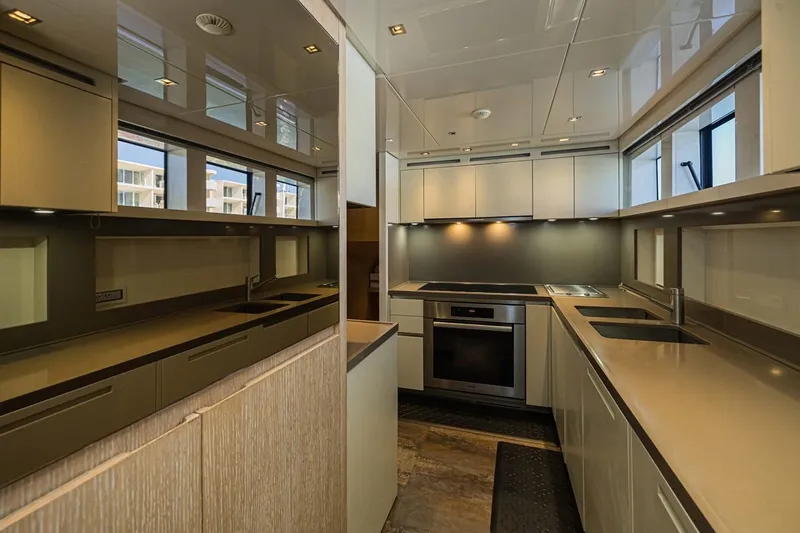 Percal Yacht Photos Pics Luxurious kitchen interior of 2014 Sanlorenzo SL104-586 yacht with modern appliances and sleek design.