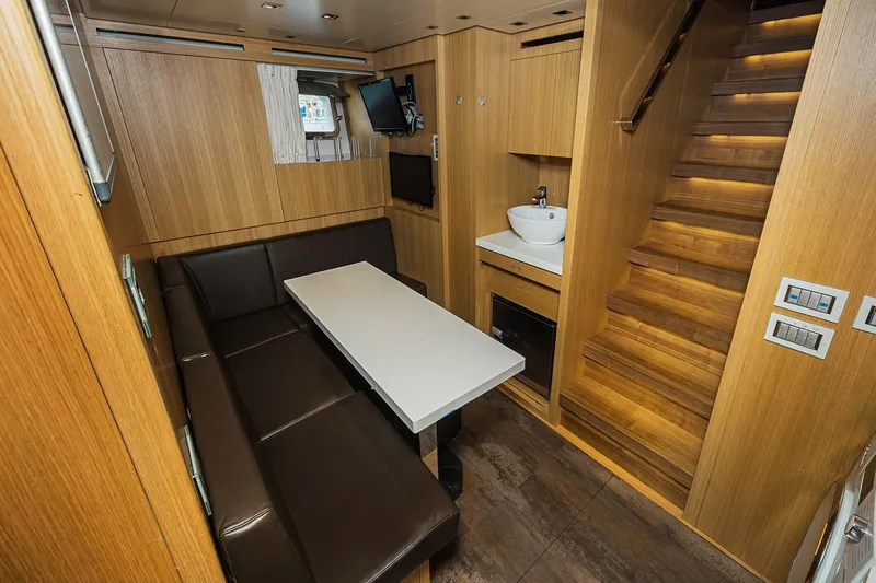 Percal Yacht Photos Pics Luxurious 2014 Sanlorenzo SL104-586 yacht interior with dining area and staircase.