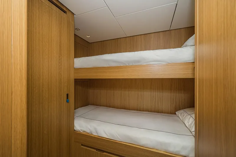 Percal Yacht Photos Pics Bunk beds in Sanlorenzo SL104-586 yacht, 2014 model, with wooden interior design.