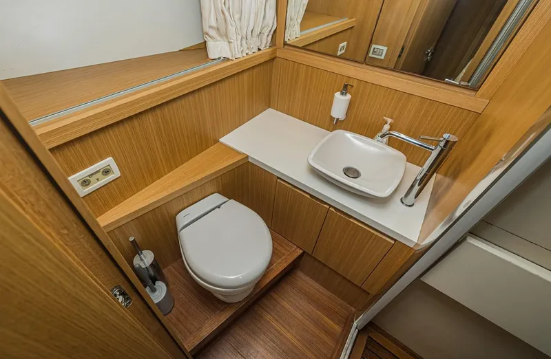 Percal Yacht Photos Pics Luxurious Sanlorenzo SL104-586 yacht bathroom with modern fixtures, wooden accents, and elegant design.