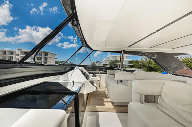Percal Yacht Photos Pics Luxurious interior of 2014 Sanlorenzo SL104-586 yacht with modern seating and panoramic windows.