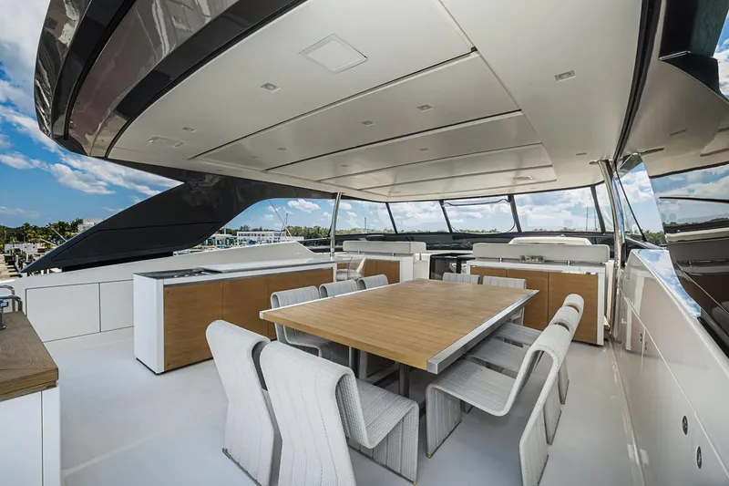 Percal Yacht Photos Pics Luxurious Sanlorenzo SL104-586 yacht deck with dining area, modern design, and panoramic views.