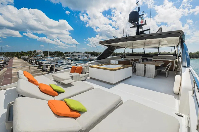 Percal Yacht Photos Pics Luxurious 2014 Sanlorenzo SL104-586 yacht with spacious sun deck and vibrant cushions.