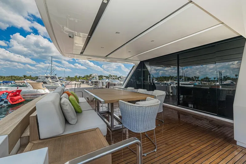 Percal Yacht Photos Pics Luxurious 2014 Sanlorenzo SL104-586 yacht deck with elegant seating and dining area.