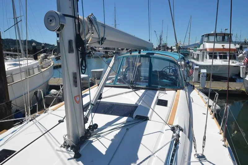 Leah Yacht Photos Pics 2014 Jeanneau Sun Odyssey 469 sailboat docked in a marina, clear blue sky.