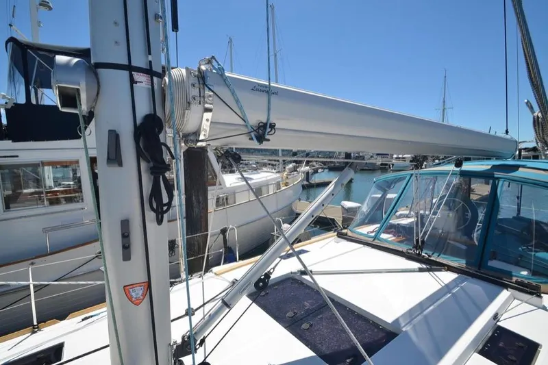 Leah Yacht Photos Pics 2014 Jeanneau Sun Odyssey 469 sailboat mast and deck in marina setting.